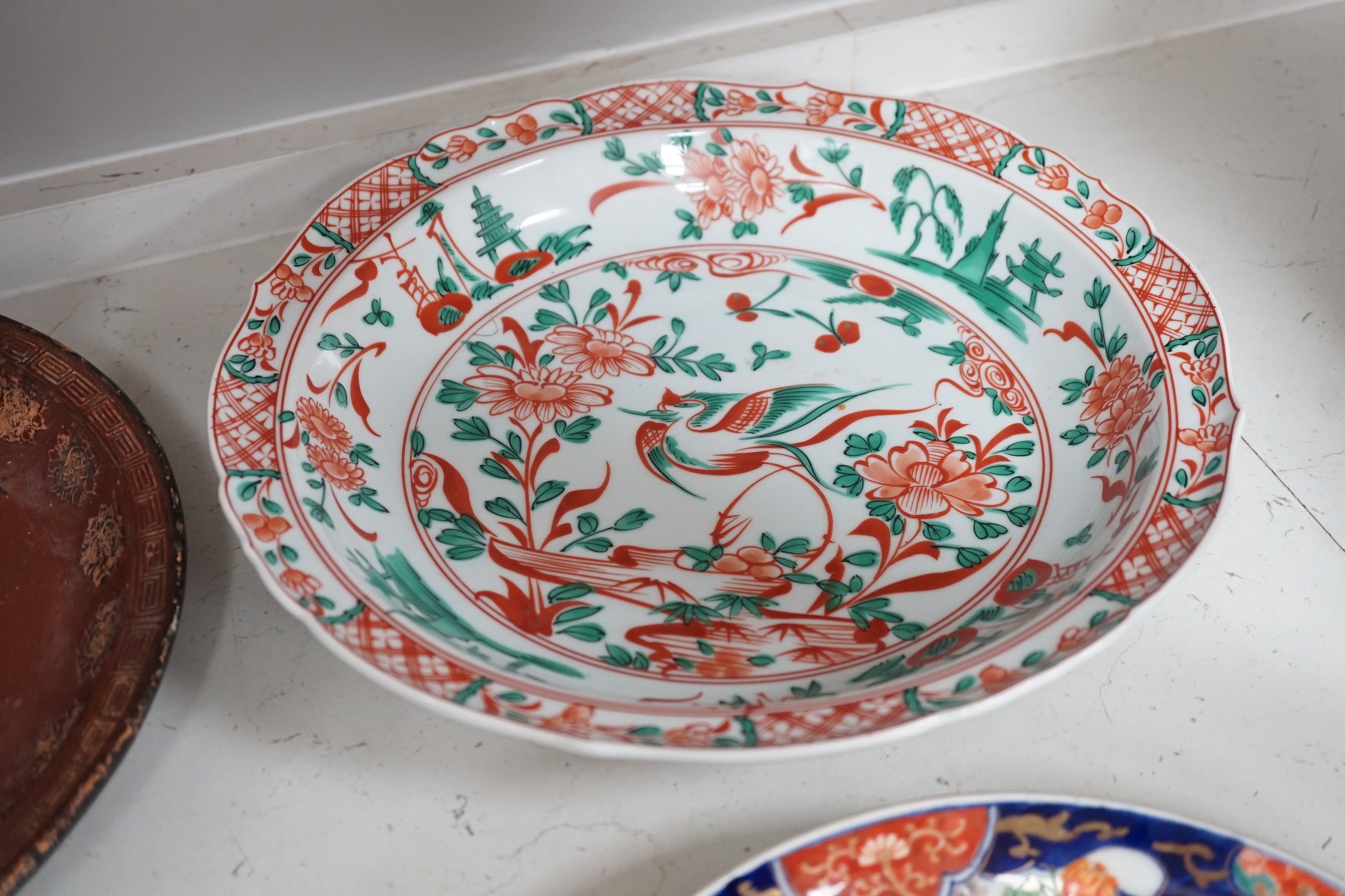 A group of 19th/20th century Japanese porcelain and pottery dishes. Largest 33cm diameter